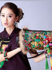 raccoon fur trim embroidered duffle bag